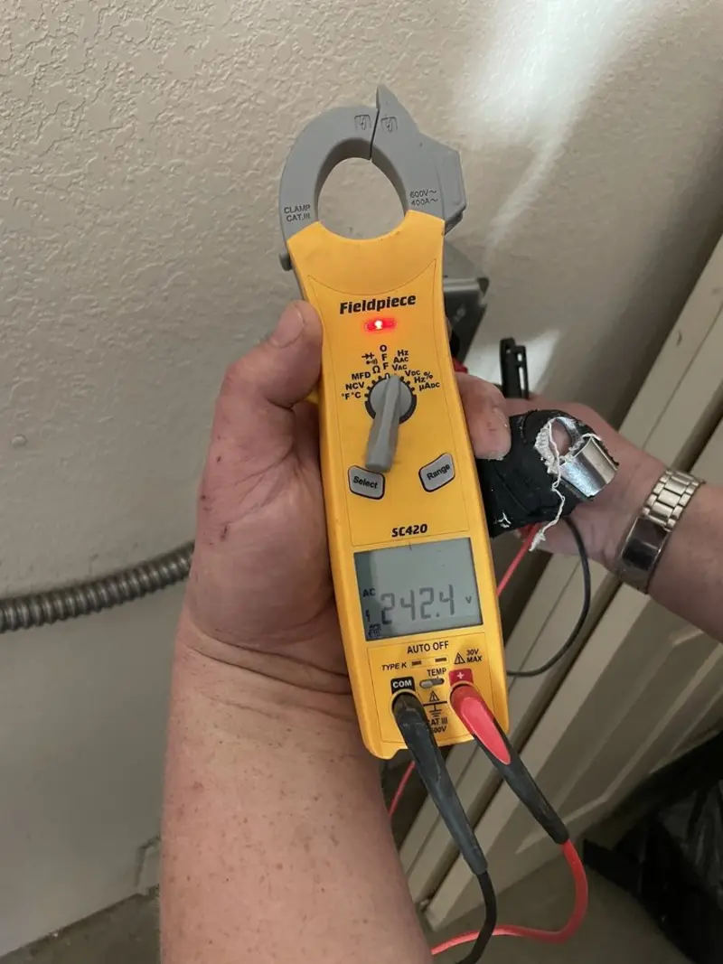 Voltage testing with clamp meter during Whole House Surge Protector in Sheldon